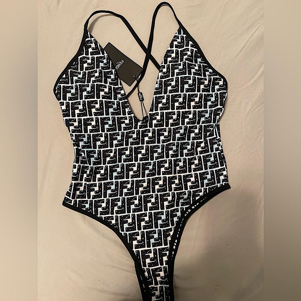 Printed logo bathing suit. Brand new with tags. Size XL , fits like Large.